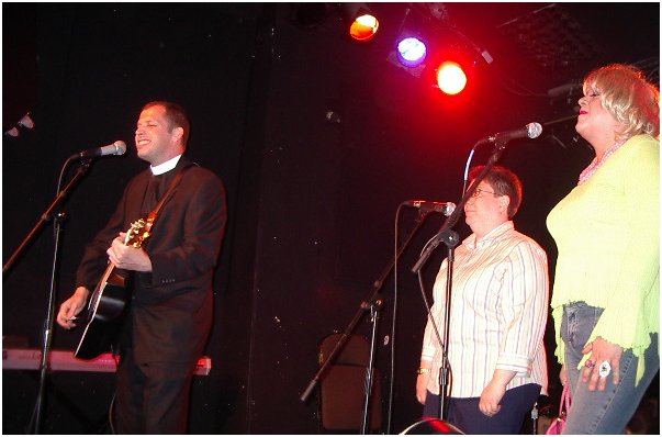 Kris Landherr, backed up by Corinne Curcio and Clover Honey